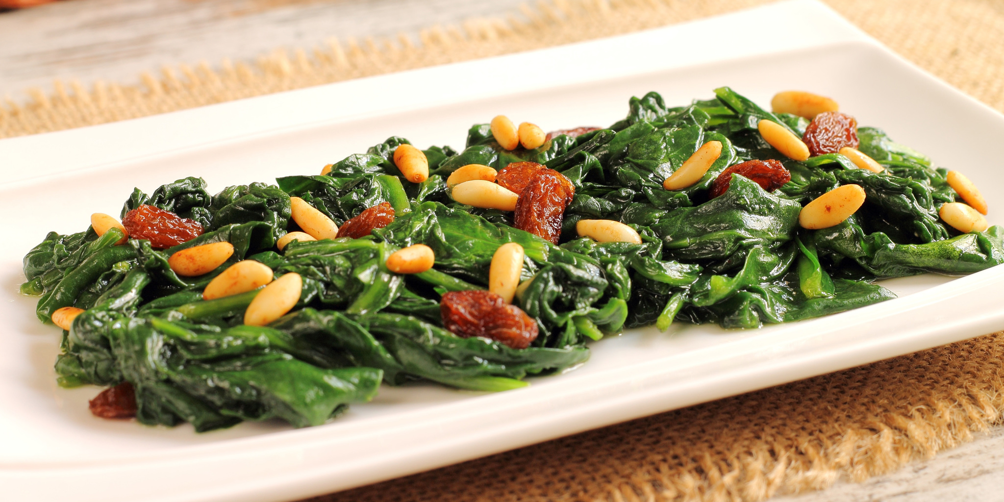 Wilted Spinach with Pine Nuts and Raisins at foodious.com