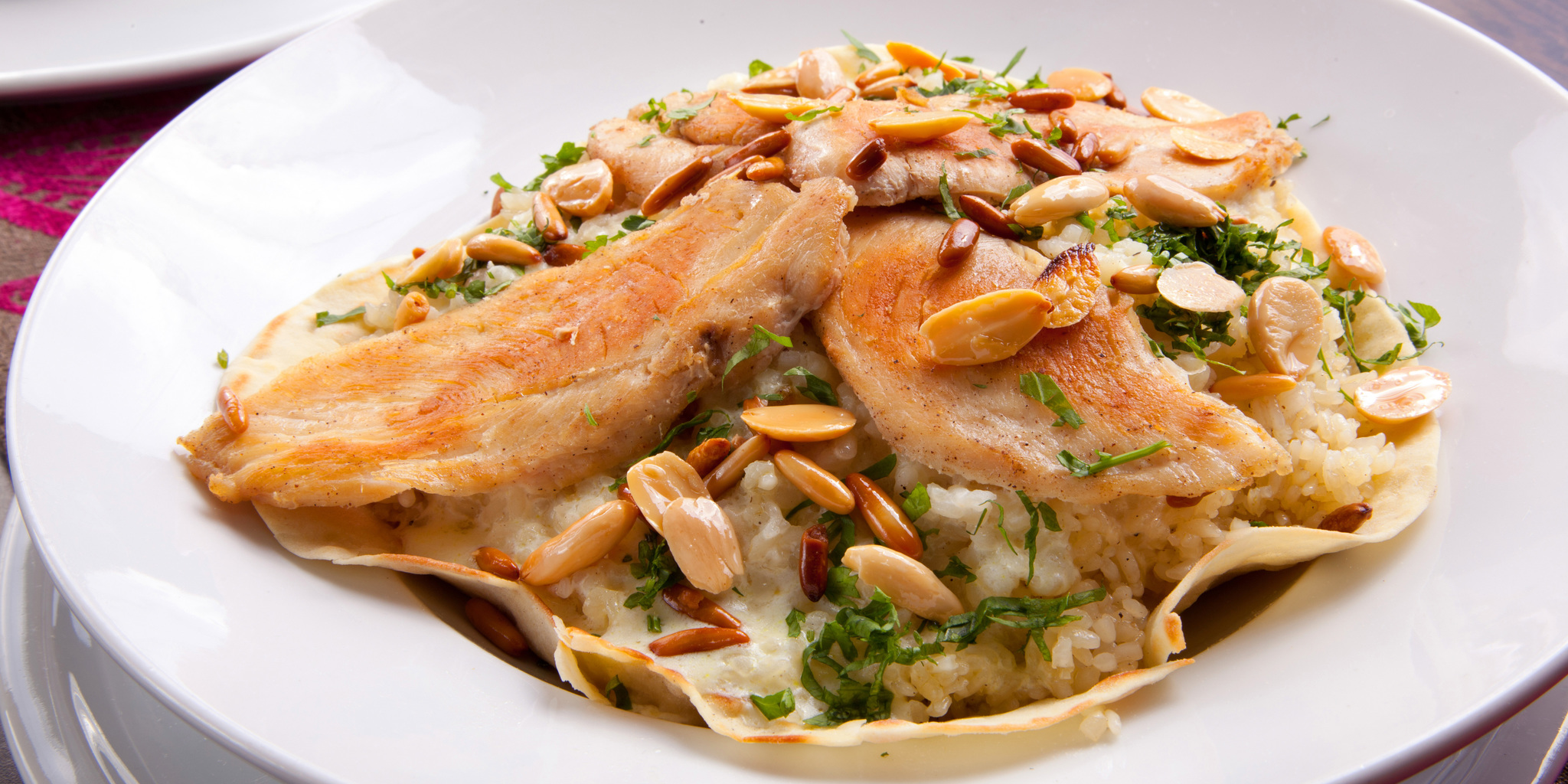 Parmesan Risotto with Sliced Chicken Breast and Toasted Nuts at foodious.com